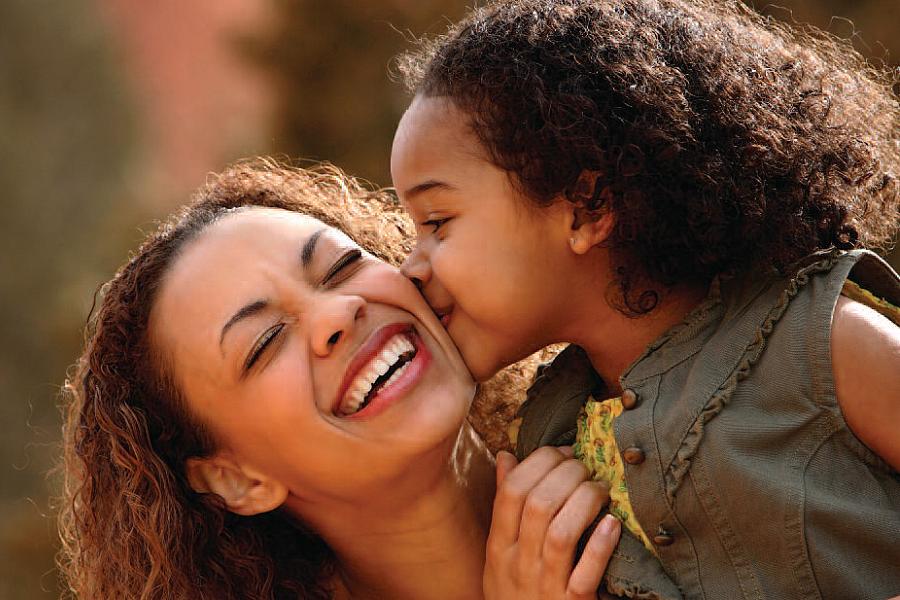 Mother and daughter laughing together