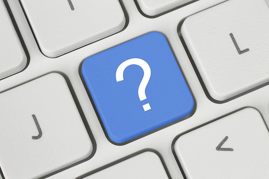 Blue question mark key on a keyboard