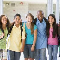 A group of elementary school children smiling.